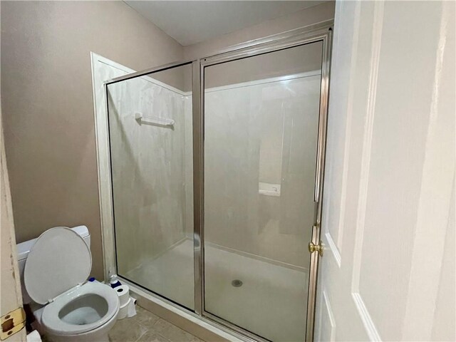 2986 Palm Dr, Slidell, LA 70458 - bathroom featuring a shower stall and tile patterned floors