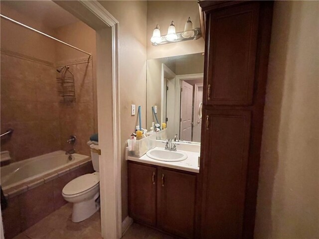 2986 Palm Dr, Slidell, LA 70458 - full bathroom featuring tile patterned floors, tiled shower / bath, and vanity