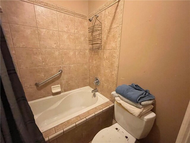 2986 Palm Dr, Slidell, LA 70458 - bathroom with tiled shower / bath and toilet