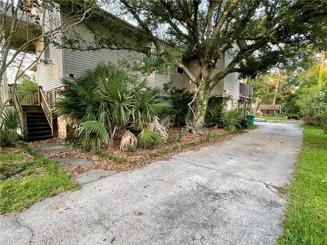 2986 Palm Dr, Slidell, LA 70458 - view of home's exterior with stairs and driveway