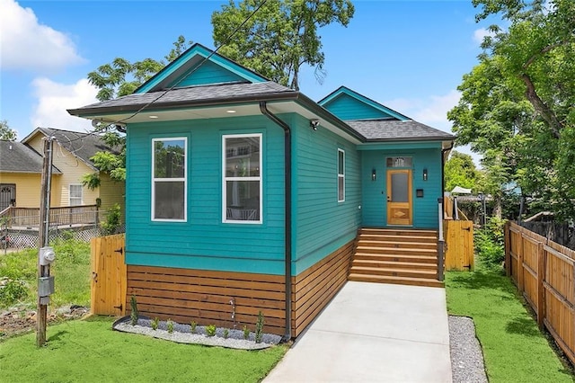 1871 N Roman St, New Orleans, LA 70116 - view of front facade featuring roof with shingles