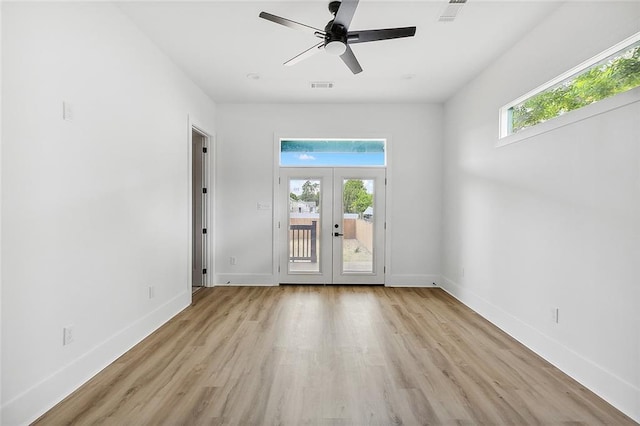 1871 N Roman St, New Orleans, LA 70116 - unfurnished room with french doors, light wood finished floors, and a ceiling fan