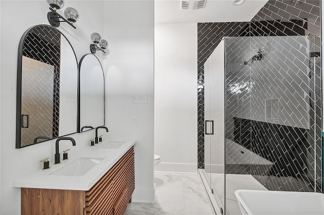 1871 N Roman St, New Orleans, LA 70116 - bathroom with marble finish flooring, a freestanding bath, a shower stall, and double vanity