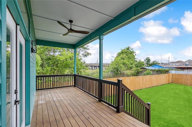 1871 N Roman St, New Orleans, LA 70116 - wooden deck with ceiling fan and a fenced backyard