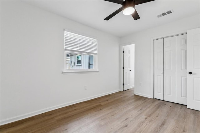 1828 San Francisco Rd, La Place, LA 70068 - unfurnished bedroom with light wood-style floors, a closet, and a ceiling fan