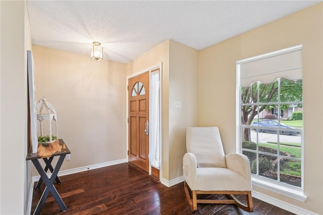 416 Spartan Loop, Slidell, LA 70458 - foyer entrance featuring dark wood-style floors and a textured ceiling