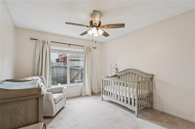 416 Spartan Loop, Slidell, LA 70458 - carpeted bedroom with ceiling fan, a crib, and a textured ceiling