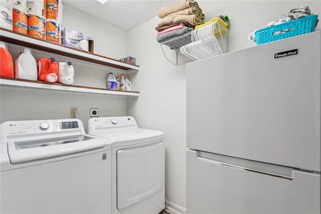 416 Spartan Loop, Slidell, LA 70458 - washroom featuring washing machine and dryer and a textured ceiling