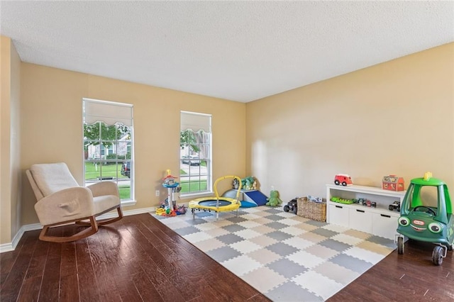 416 Spartan Loop, Slidell, LA 70458 - rec room featuring hardwood / wood-style flooring and a textured ceiling