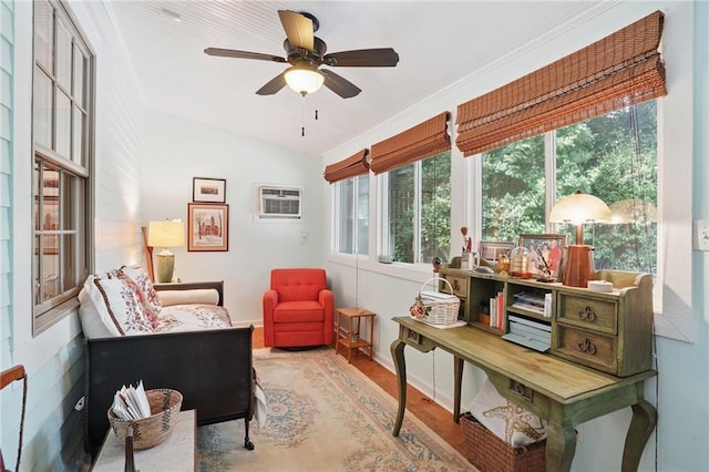 626 Independence St, New Orleans, LA 70117 - sitting room with a wall mounted AC, wood finished floors, ceiling fan, and lofted ceiling