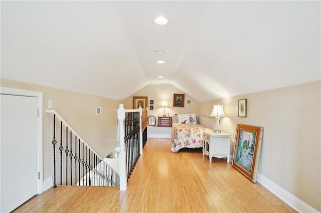626 Independence St, New Orleans, LA 70117 - bedroom with light wood-style flooring, lofted ceiling, and recessed lighting