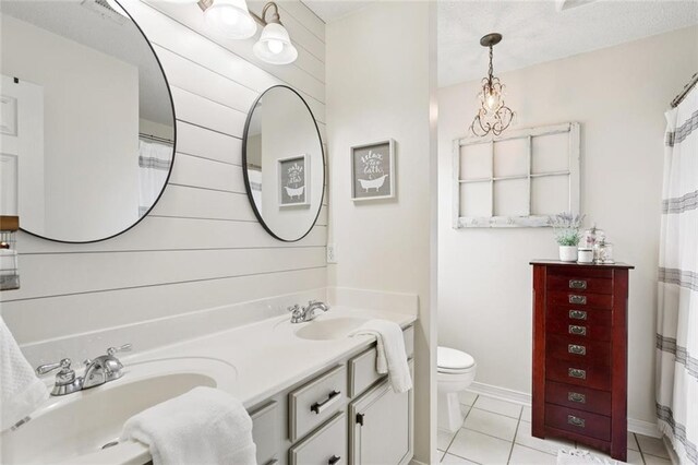 240 Emerald Crk W, Abita Springs, LA 70420 - full bath featuring double vanity, tile patterned flooring, and a shower with shower curtain
