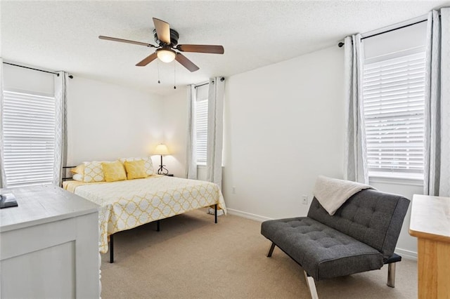 240 Emerald Crk W, Abita Springs, LA 70420 - bedroom with light carpet, ceiling fan, and a textured ceiling