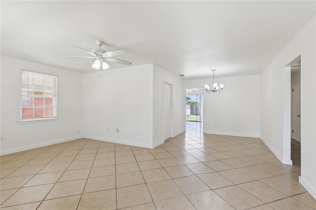 6501 Lafreniere St, Metairie, LA 70003 - spare room with a chandelier, light tile patterned floors, and ceiling fan
