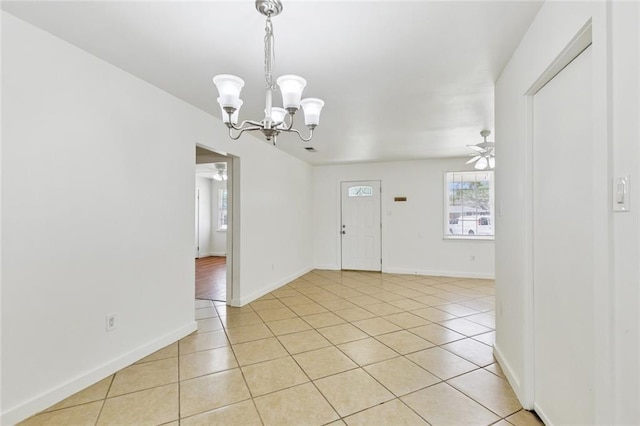 6501 Lafreniere St, Metairie, LA 70003 - entryway with light tile patterned floors, ceiling fan, and a chandelier