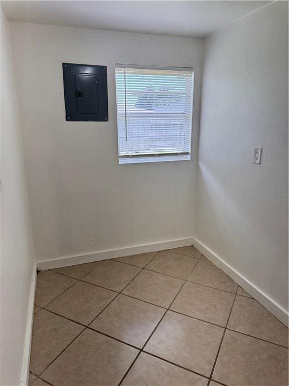 6501 Lafreniere St, Metairie, LA 70003 - spare room featuring electric panel and light tile patterned floors