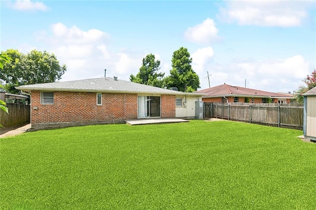 6501 Lafreniere St, Metairie, LA 70003 - rear view of house featuring a fenced backyard, brick siding, and a patio area