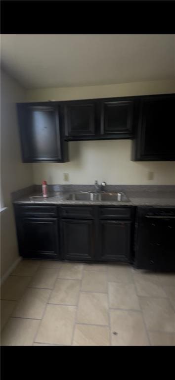 2006 Clouet St, New Orleans, LA 70117 - kitchen with black dishwasher and dark cabinetry