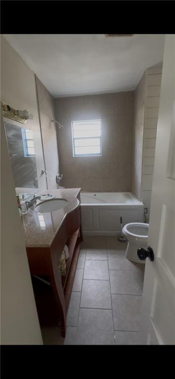 2006 Clouet St, New Orleans, LA 70117 - bathroom featuring tile patterned flooring, a tub, and vanity