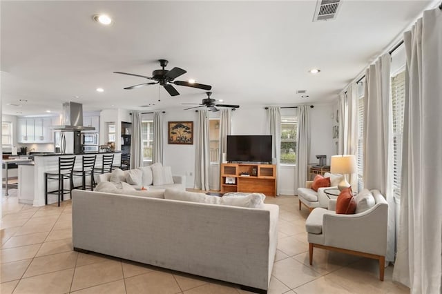6910 General Diaz St, New Orleans, LA 70124 - living room featuring light tile patterned flooring, a ceiling fan, and recessed lighting