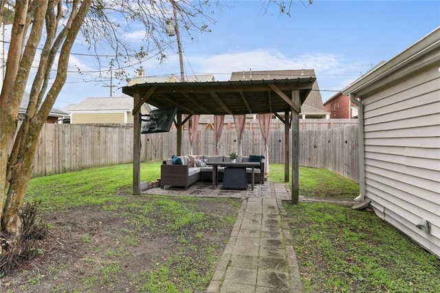 6910 General Diaz St, New Orleans, LA 70124 - fenced backyard with an outdoor hangout area and a patio area