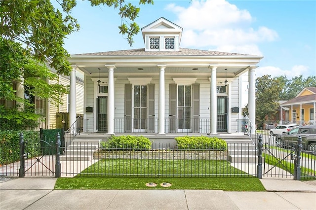 4532-34 Chestnut St, New Orleans, LA 70115 - view of front of house featuring a porch, a gate, and a fenced front yard
