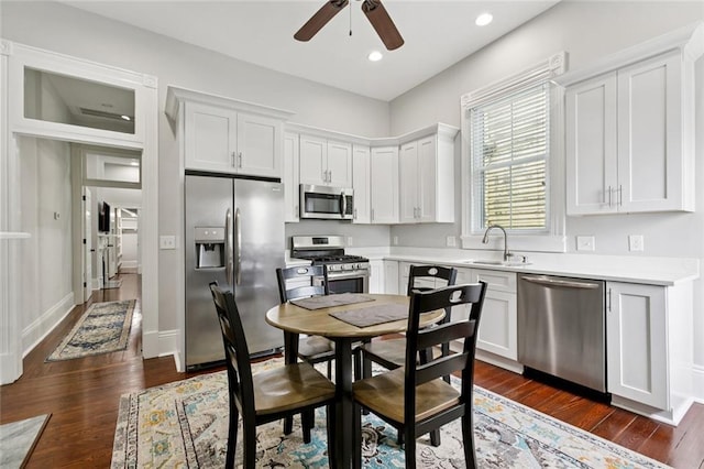 4532-34 Chestnut St, New Orleans, LA 70115 - kitchen featuring stainless steel appliances, a ceiling fan, white cabinetry, dark wood-style floors, and light countertops
