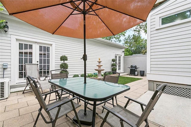 4532-34 Chestnut St, New Orleans, LA 70115 - view of patio / terrace featuring french doors and outdoor dining space