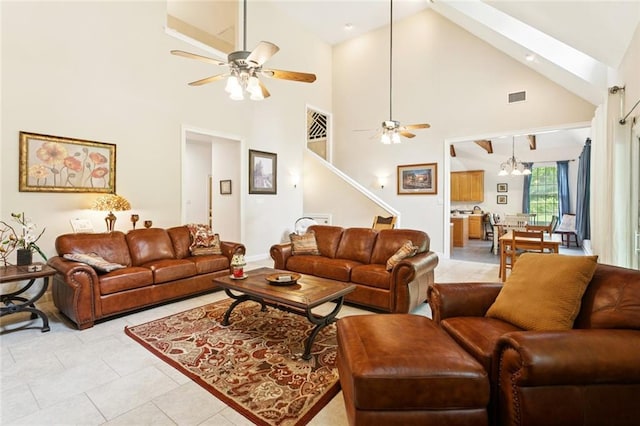 19632 Carol Morgan Rd, Franklinton, LA 70438 - living room with a ceiling fan, high vaulted ceiling, stairway, and light tile patterned floors