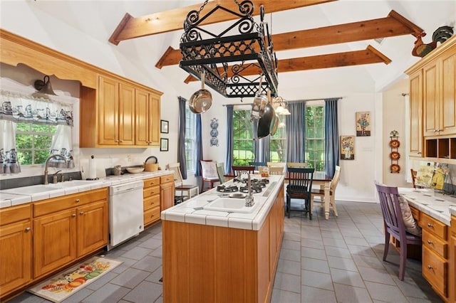 19632 Carol Morgan Rd, Franklinton, LA 70438 - kitchen featuring dishwasher, tile counters, tile patterned flooring, a kitchen island, and plenty of natural light