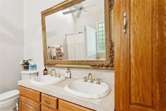 19632 Carol Morgan Rd, Franklinton, LA 70438 - bathroom with double vanity, a ceiling fan, and a shower with curtain