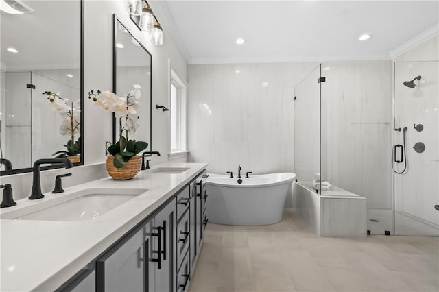 1169 Fox Sparrow Loop, Madisonville, LA 70447 - bathroom with a stall shower, a freestanding tub, double vanity, crown molding, and recessed lighting