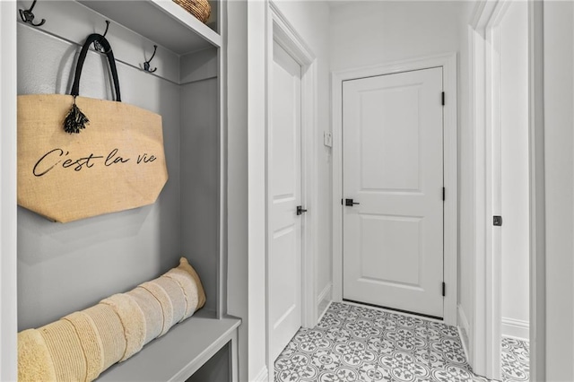 1169 Fox Sparrow Loop, Madisonville, LA 70447 - mudroom featuring tile patterned floors and baseboards