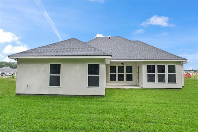 1169 Fox Sparrow Loop, Madisonville, LA 70447 - back of house featuring a ceiling fan, a shingled roof, a lawn, and a patio area