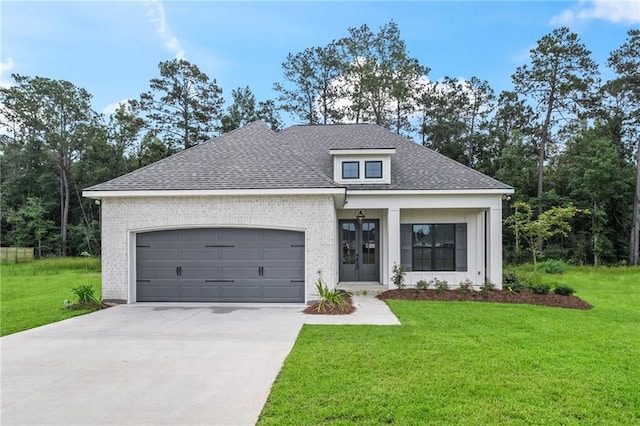 1169 Fox Sparrow Loop, Madisonville, LA 70447 - view of front of home featuring concrete driveway, a garage, a shingled roof, a front lawn, and brick siding