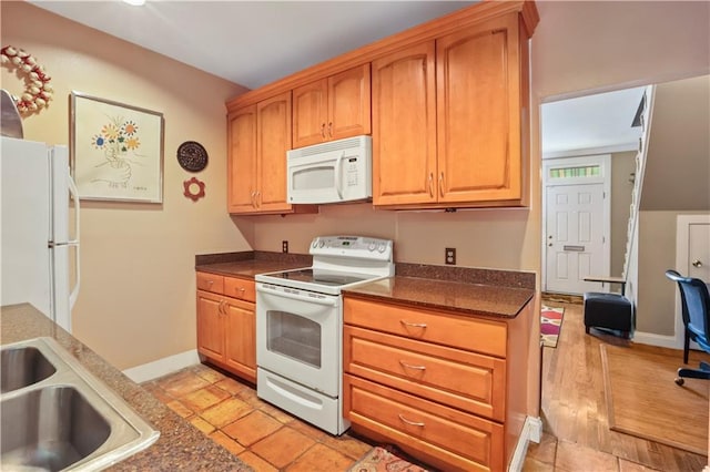 706 General Pershing St Unit 706, New Orleans, LA 70115 - kitchen featuring white appliances and dark countertops
