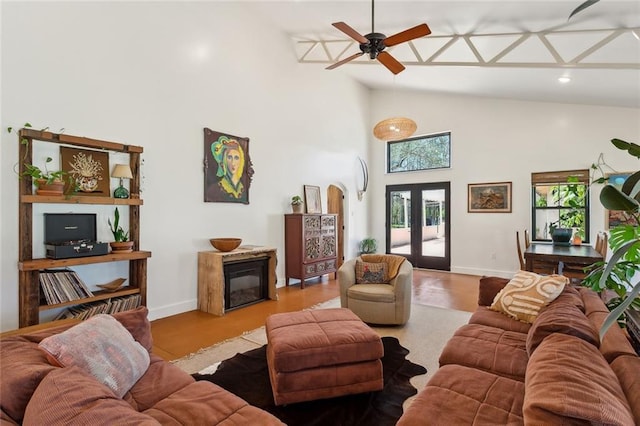 80695 Bob Baxter Rd, Bush, LA 70431 - living room with a ceiling fan, high vaulted ceiling, wood finished floors, a glass covered fireplace, and recessed lighting