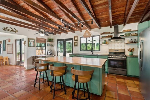 80695 Bob Baxter Rd, Bush, LA 70431 - kitchen with green cabinets, stainless steel appliances, ventilation hood, wooden ceiling, and open shelves