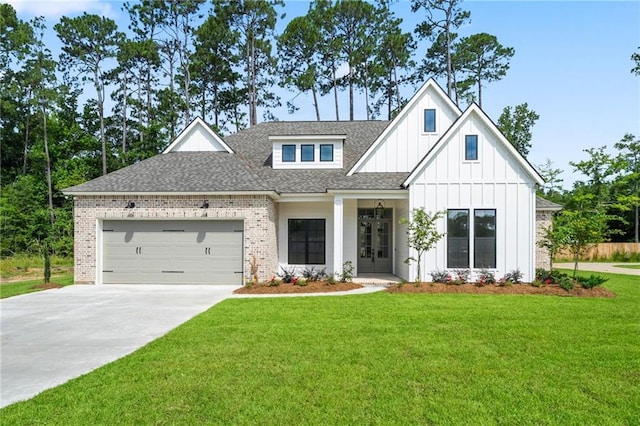 4141 Endor Loop, Mandeville, LA 70448 - modern farmhouse style home featuring concrete driveway, board and batten siding, a garage, a front lawn, and a shingled roof