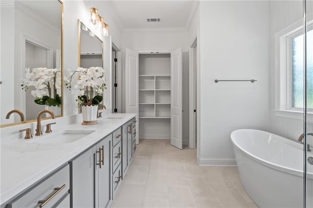 4141 Endor Loop, Mandeville, LA 70448 - full bathroom featuring double vanity, a soaking tub, and ornamental molding