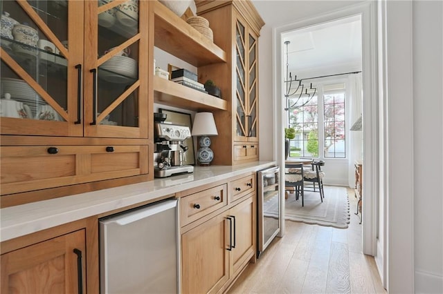 303 W William David Pkwy, Metairie, LA 70005 - bar area with beverage cooler, light wood finished floors, and fridge