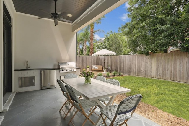 303 W William David Pkwy, Metairie, LA 70005 - fenced backyard featuring area for grilling, ceiling fan, a patio, and outdoor dining area