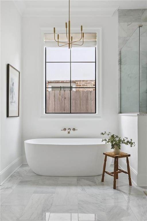 303 W William David Pkwy, Metairie, LA 70005 - bathroom with a freestanding bath, marble finish floors, a chandelier, and a marble finish shower