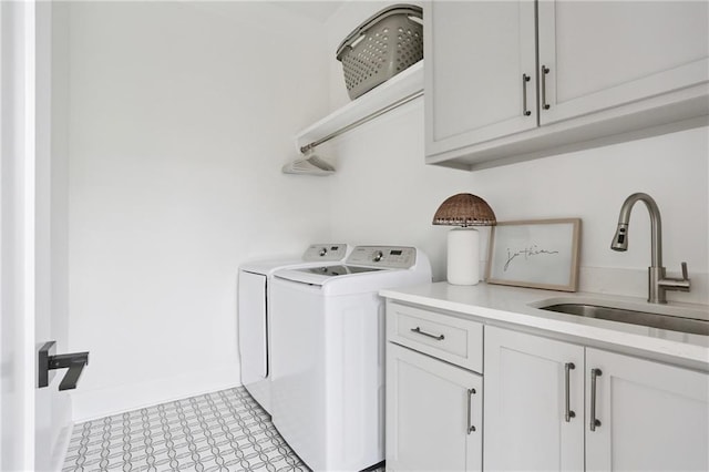 303 W William David Pkwy, Metairie, LA 70005 - laundry room featuring independent washer and dryer, cabinet space, and light floors