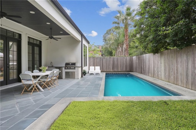 303 W William David Pkwy, Metairie, LA 70005 - view of pool with french doors, a ceiling fan, a fenced backyard, a patio area, and area for grilling
