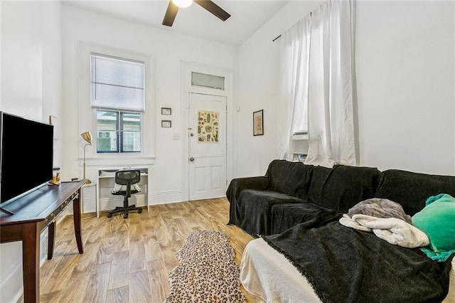 112830 N Roman St, New Orleans, LA 70116 - living room with a desk, a ceiling fan, and light wood-style flooring