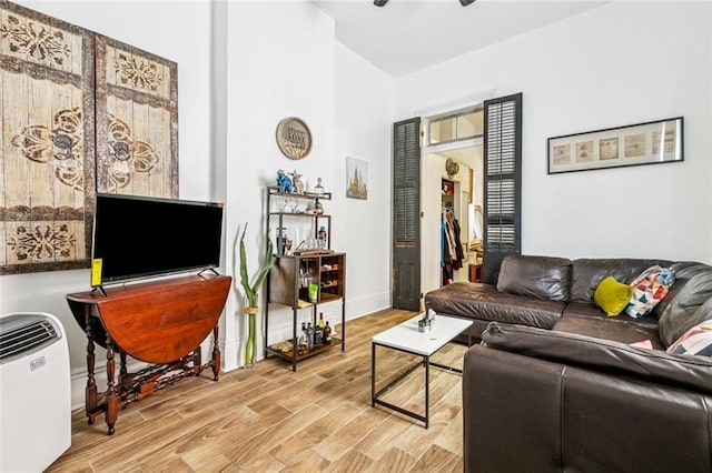 112830 N Roman St, New Orleans, LA 70116 - living room featuring light wood-style floors and baseboards