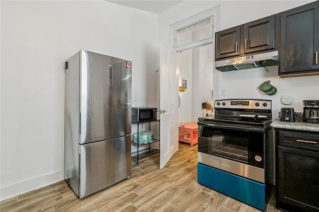 112830 N Roman St, New Orleans, LA 70116 - kitchen featuring stainless steel appliances, under cabinet range hood, light wood-type flooring, and light countertops