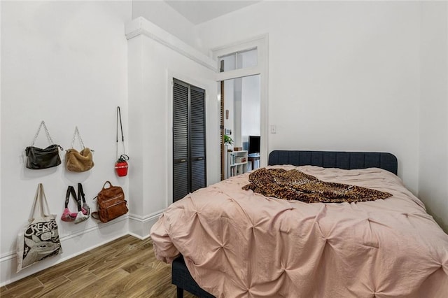 112830 N Roman St, New Orleans, LA 70116 - bedroom featuring a closet and wood finished floors