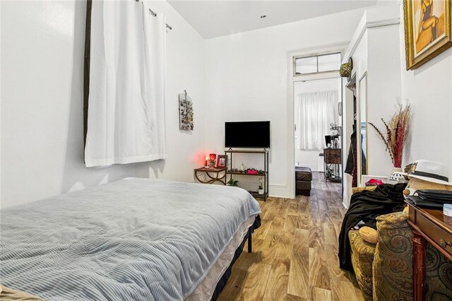 112830 N Roman St, New Orleans, LA 70116 - bedroom featuring light wood finished floors